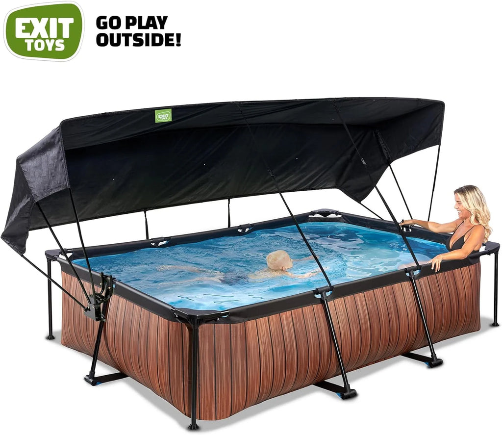 EXIT Toys Piscina de Madeira com Toldo Solar - 300x200x65cm - Piscina de Estrutura Retangular Compacta com Bomba de Filtro de Cartucho - Ótima Proteção UV - Fácil Acesso - Design Exclusivo - Marrom